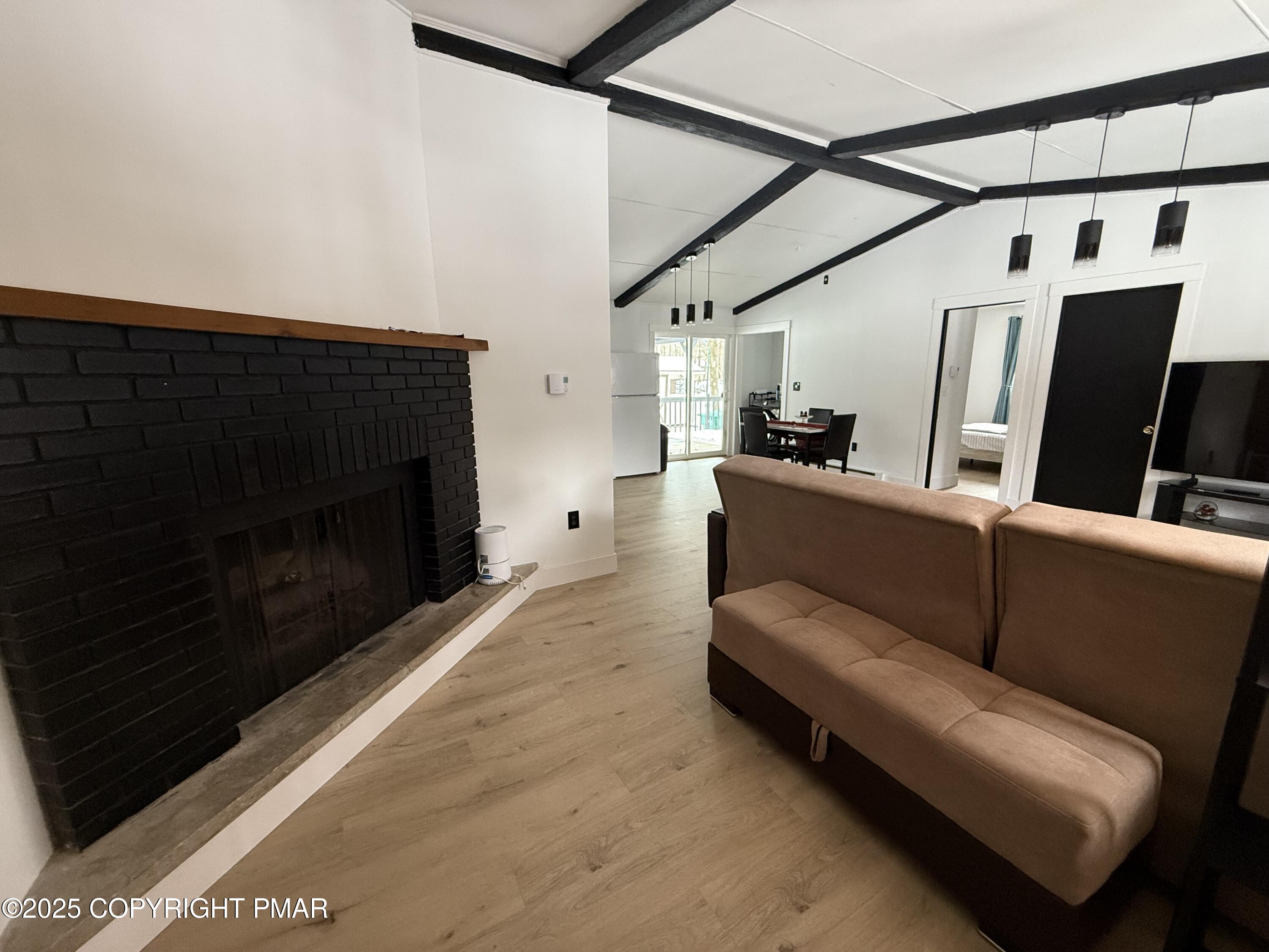 1215 Steele Circle Bushkill, PA 18324 - Photo 3 of 13 a living room with furniture and a fireplace