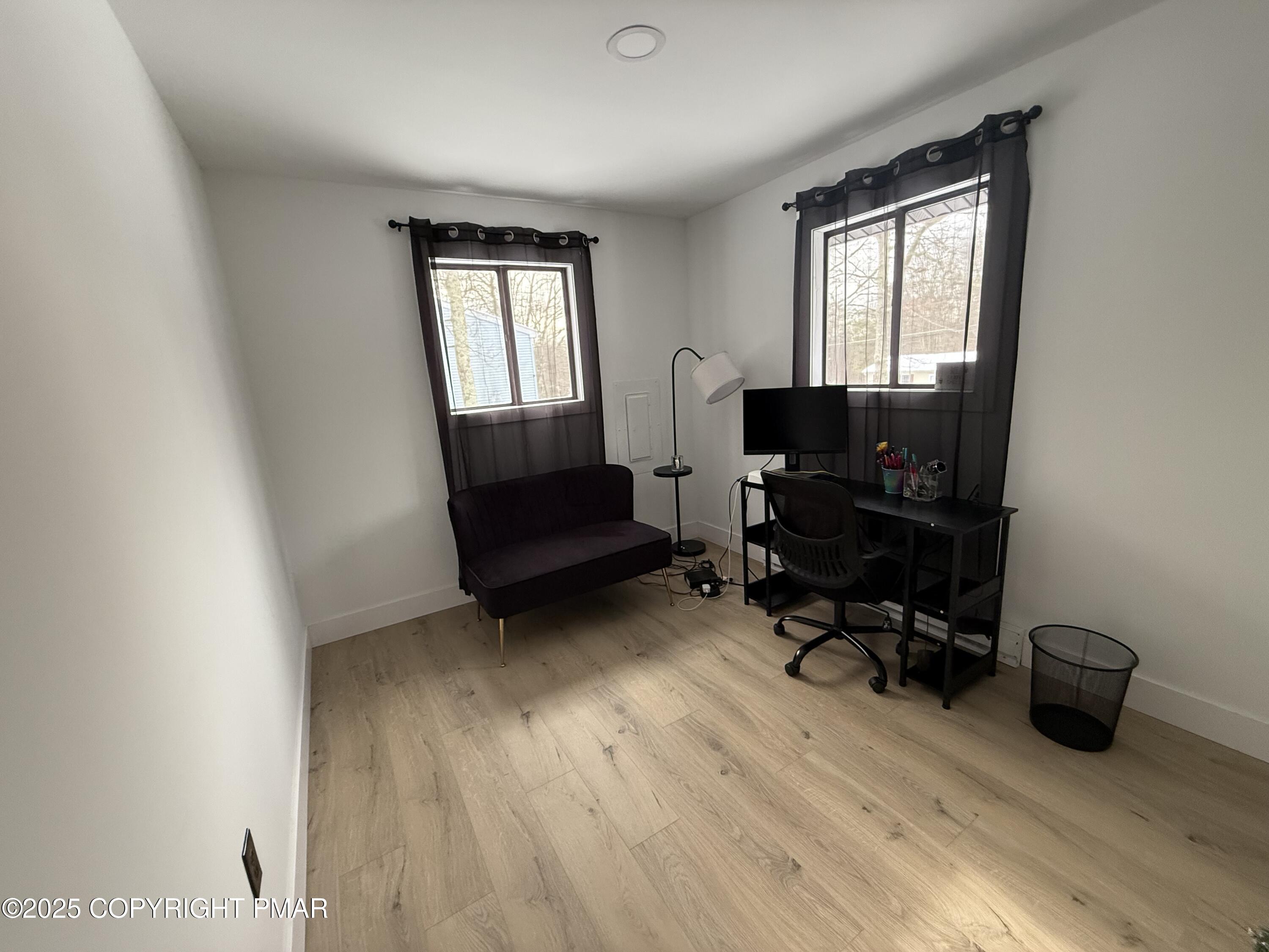 1215 Steele Circle Bushkill, PA 18324 - Photo 9 of 13 a view of a livingroom with workspace and a window