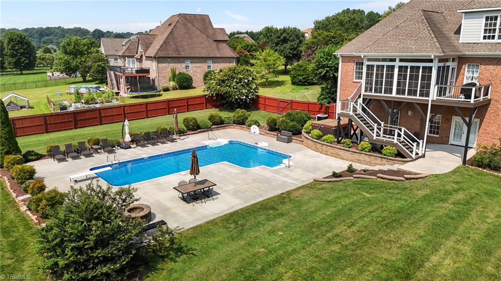 An entertainer's dream! heated saltwater pool, hot tub, covered patio, Trex decking, EZE breeze window/panel enclosed porch, privacy fence.