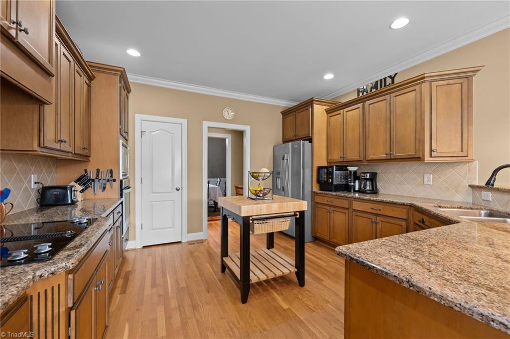 5822 Crutchfield Farm Road Oak Ridge, NC 27310 - Photo 19 of 47 Granite counters, built-in microwave and oven