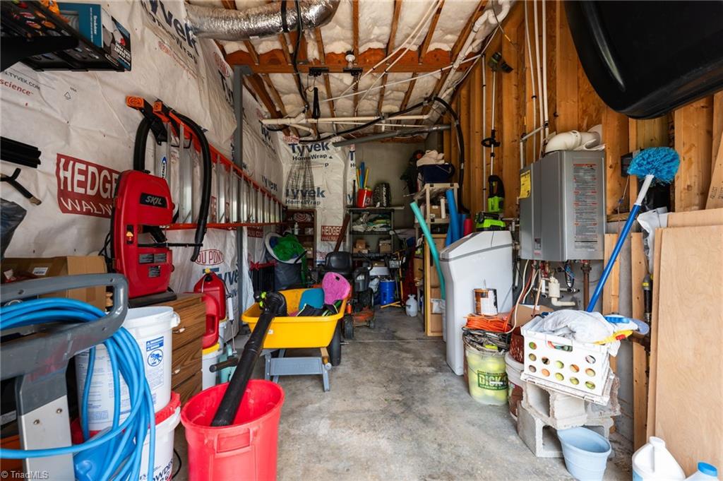 5822 Crutchfield Farm Road Oak Ridge, NC 27310 - Photo 46 of 47 3rd bay, perfect for storing pool/lawn care, equipment, golf cart, workshop