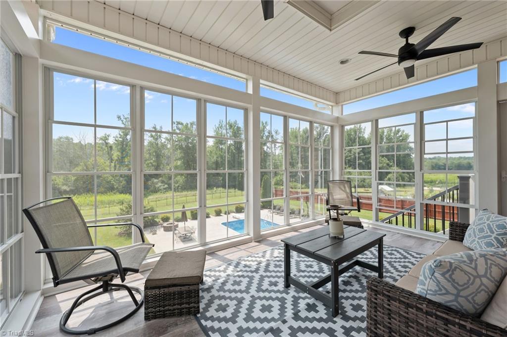 5822 Crutchfield Farm Road Oak Ridge, NC 27310 - Photo 5 of 47 EZE Breeze window panels in the enclosed porch