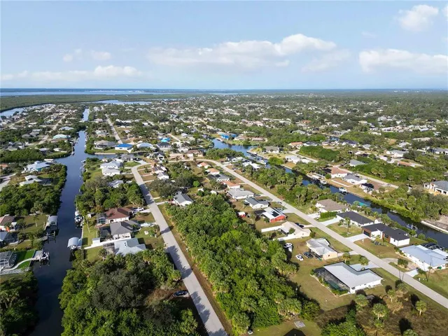 an aerial view of residential building with green space