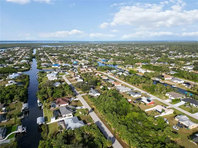 an aerial view of residential building with trees