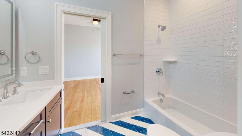 376 5th Avenue Paterson, NJ 07514 - Photo 11 of 20 a bathroom with a sink and a tub