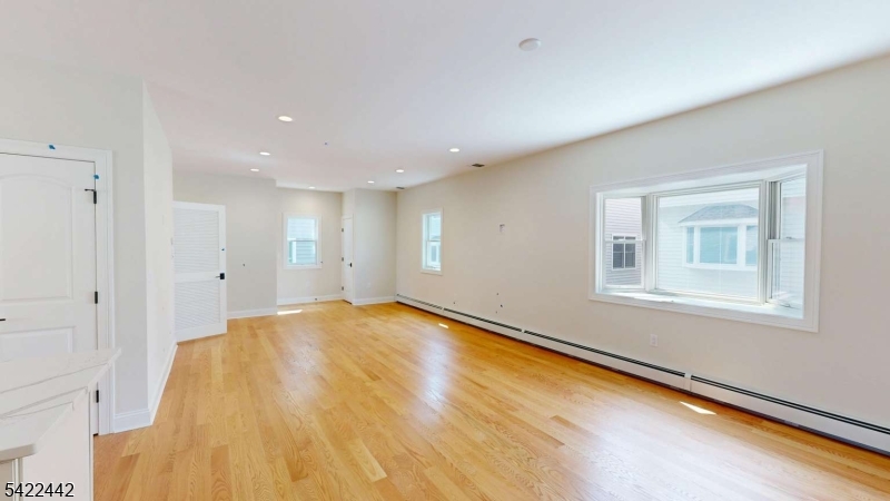 376 5th Avenue Paterson, NJ 07514 - Photo 6 of 20 a view of empty room with window