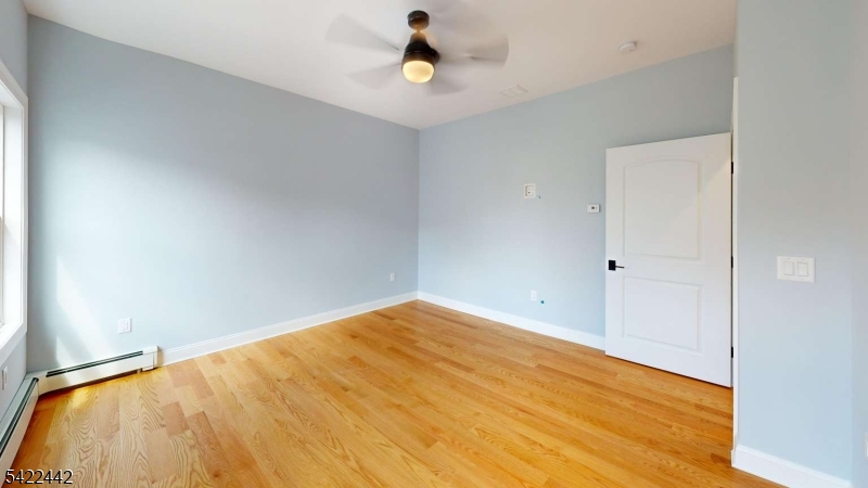 376 5th Avenue Paterson, NJ 07514 - Photo 10 of 20 a view of empty room with wooden floor