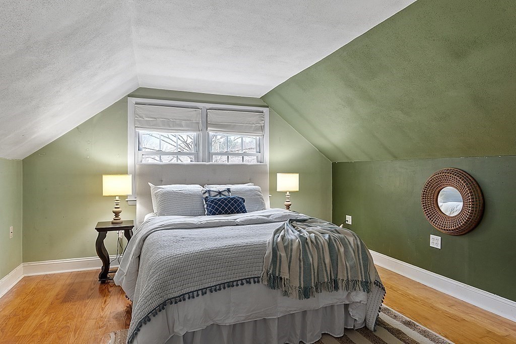 311 High Street Hampton, NH 03842 - Photo 13 of 21 a bedroom with a bed and a window
