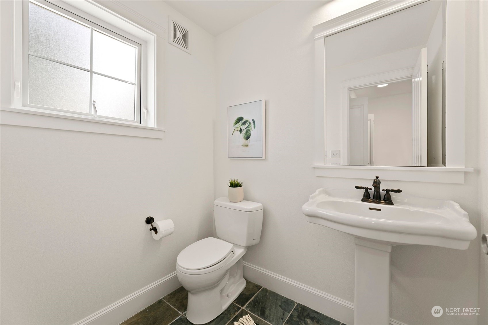2622 East Union Street Seattle, WA 98122 - Photo 11 of 30 a bathroom with a sink mirror and toilet