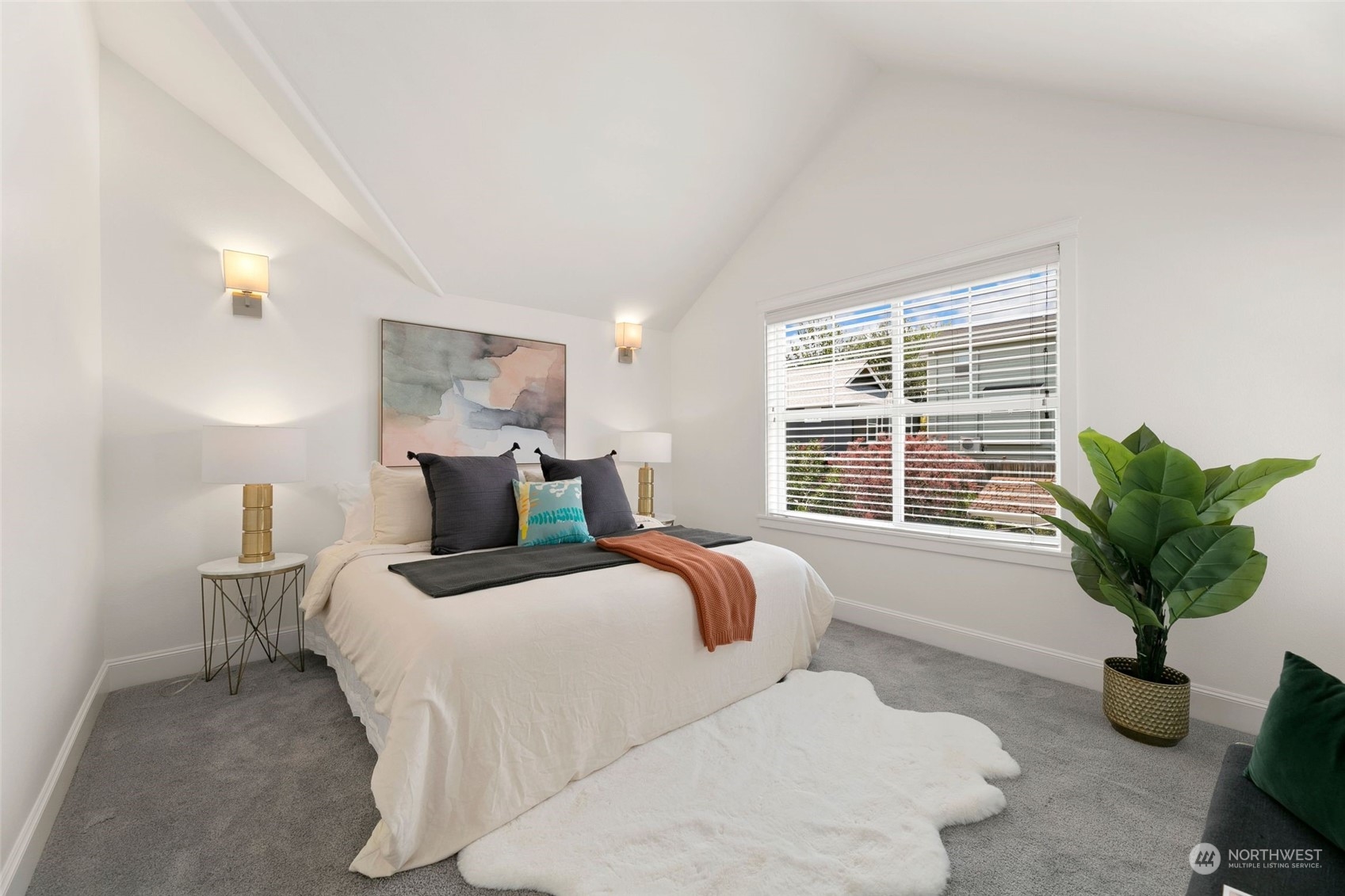 2622 East Union Street Seattle, WA 98122 - Photo 12 of 30 a bed room with a bed and a potted plant