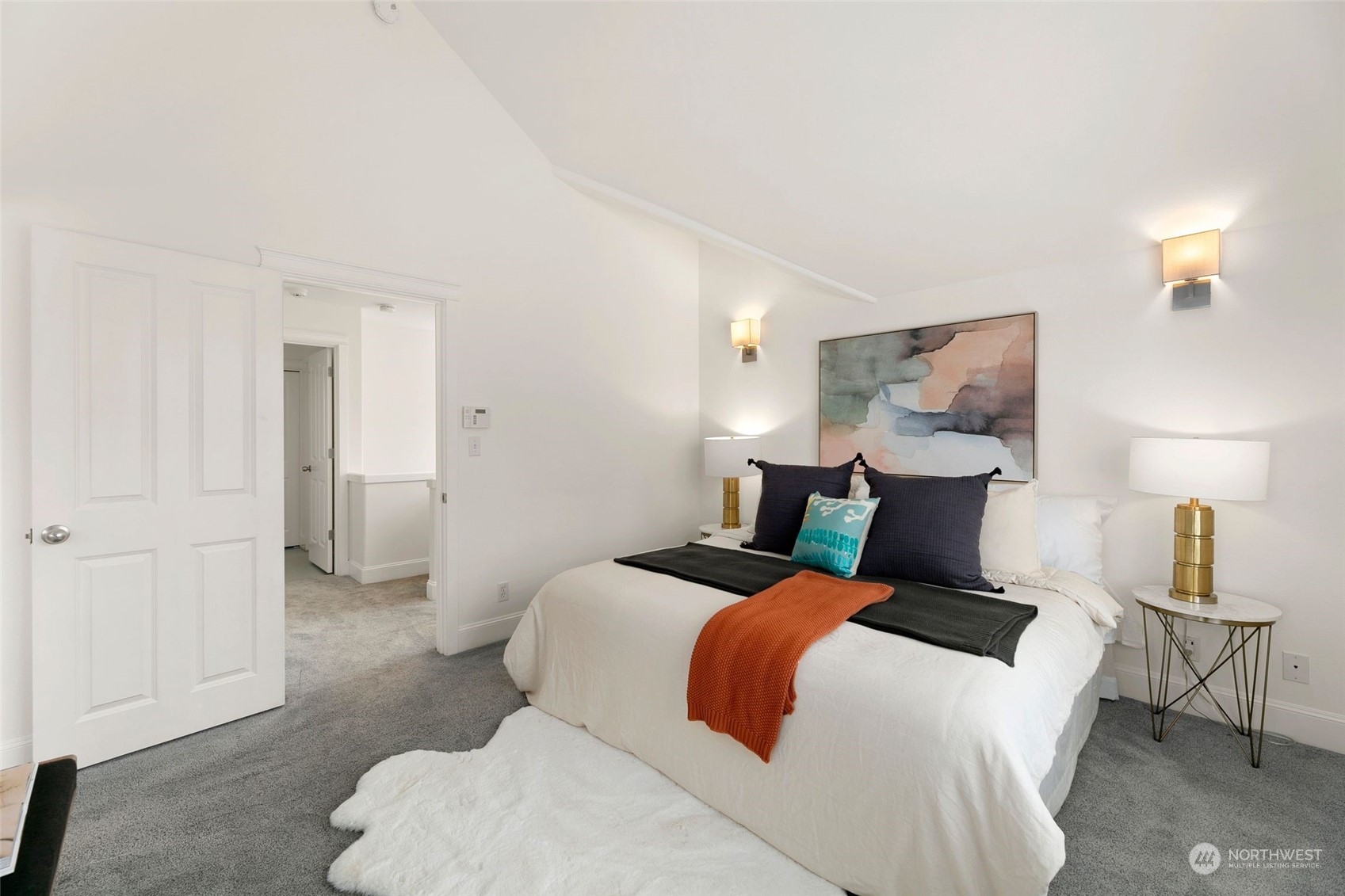 2622 East Union Street Seattle, WA 98122 - Photo 14 of 30 a bedroom with a bed and a lamp