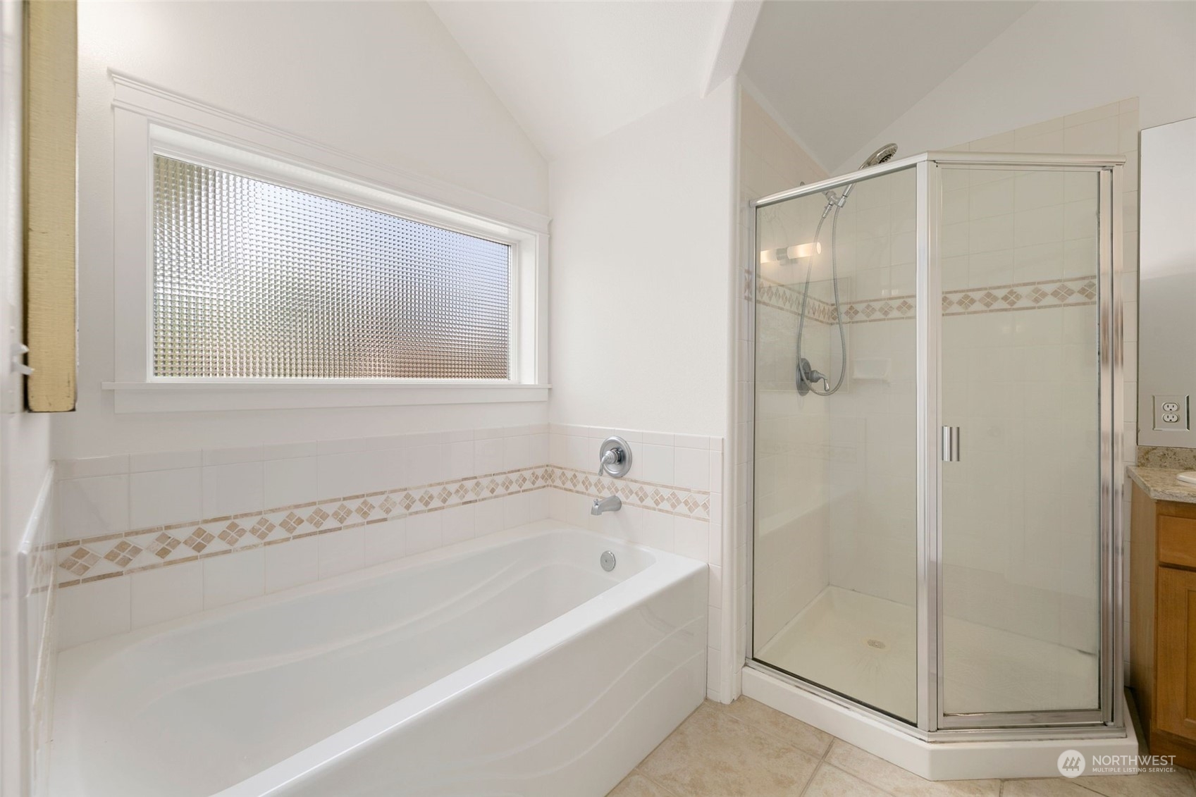 2622 East Union Street Seattle, WA 98122 - Photo 16 of 30 a bathroom with a bathtub and shower