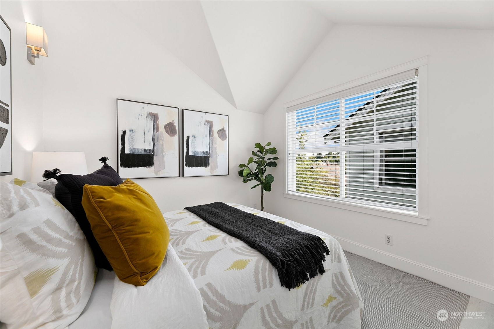 2622 East Union Street Seattle, WA 98122 - Photo 17 of 30 a bedroom with a bed and a window