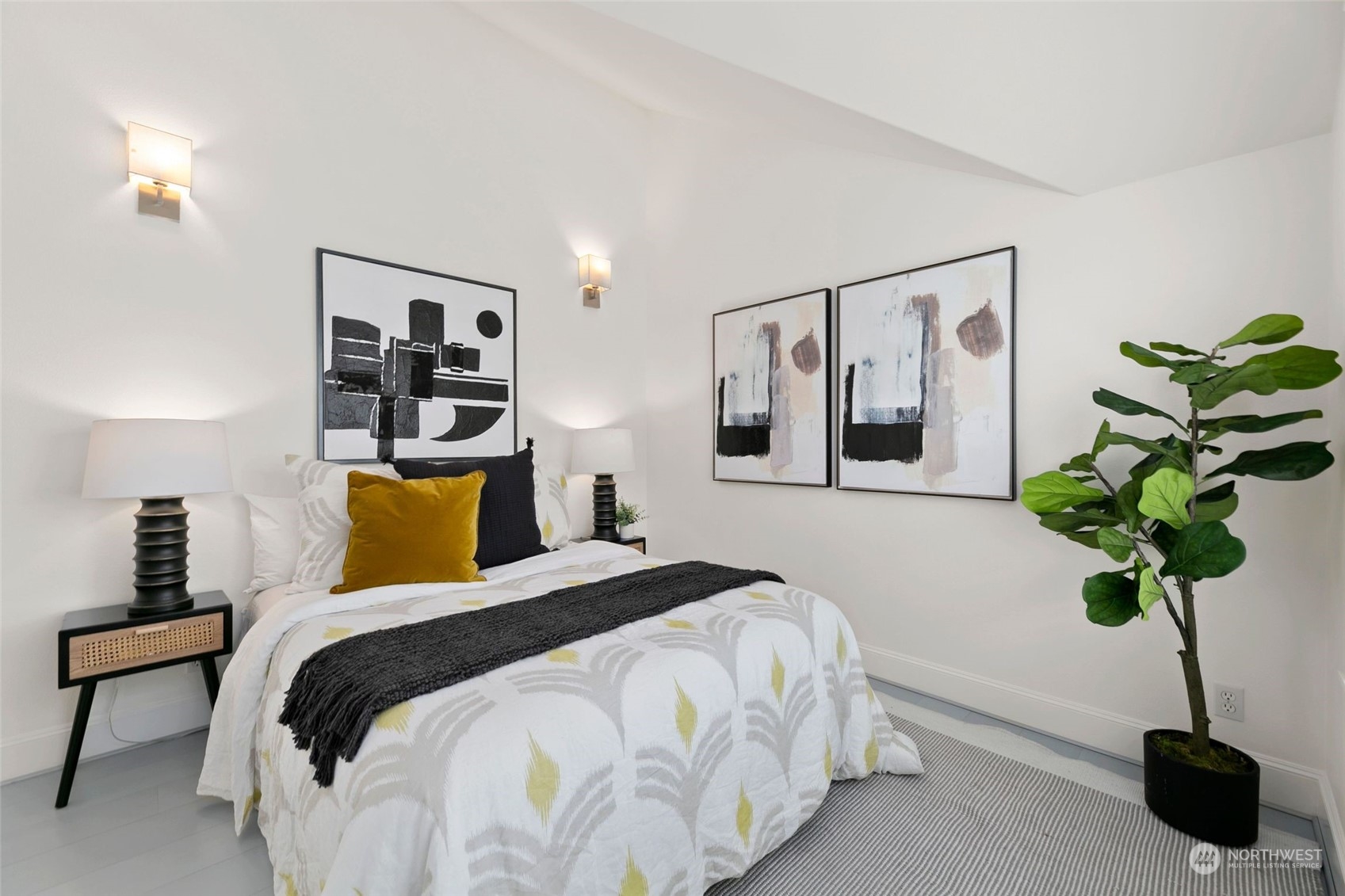 2622 East Union Street Seattle, WA 98122 - Photo 18 of 30 a bedroom with a bed and a potted plant