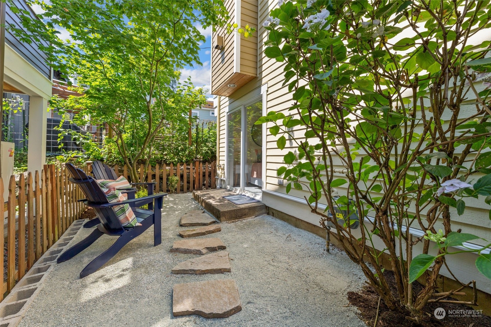 2622 East Union Street Seattle, WA 98122 - Photo 27 of 30 a view of a patio with couple of chairs and potted plants