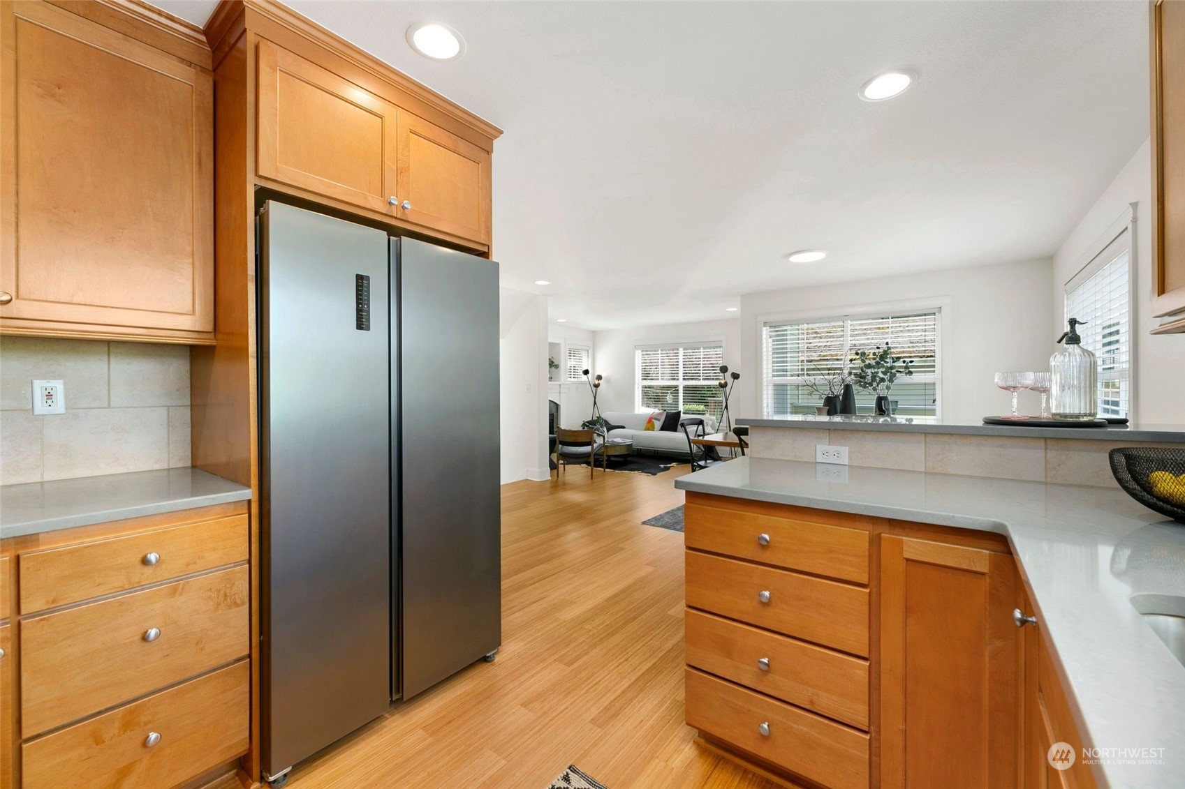 2622 East Union Street Seattle, WA 98122 - Photo 6 of 30 a kitchen with a refrigerator and cabinets
