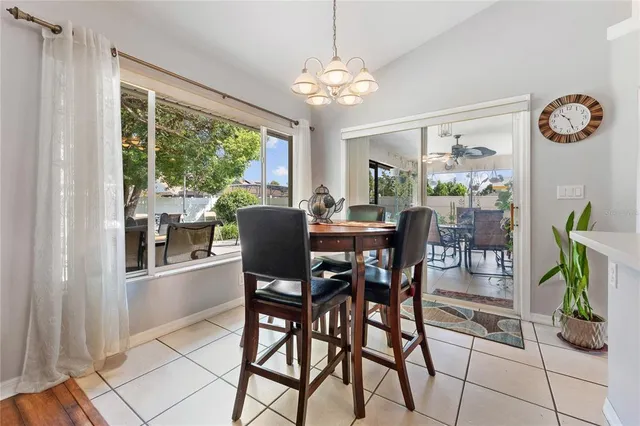 a dining room filled with furniture and window