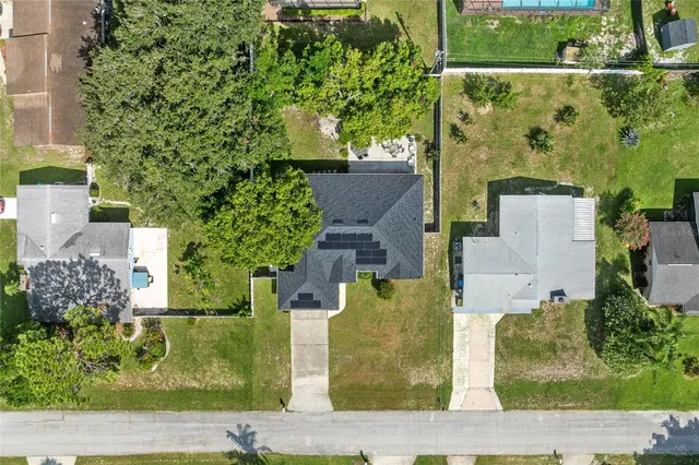 an aerial view of a house with a garden
