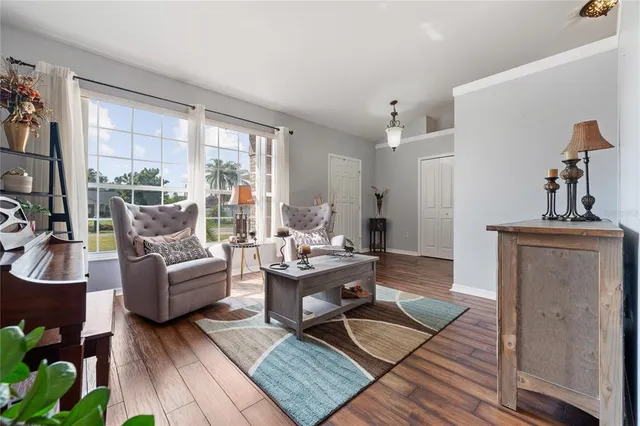a living room with furniture and a window
