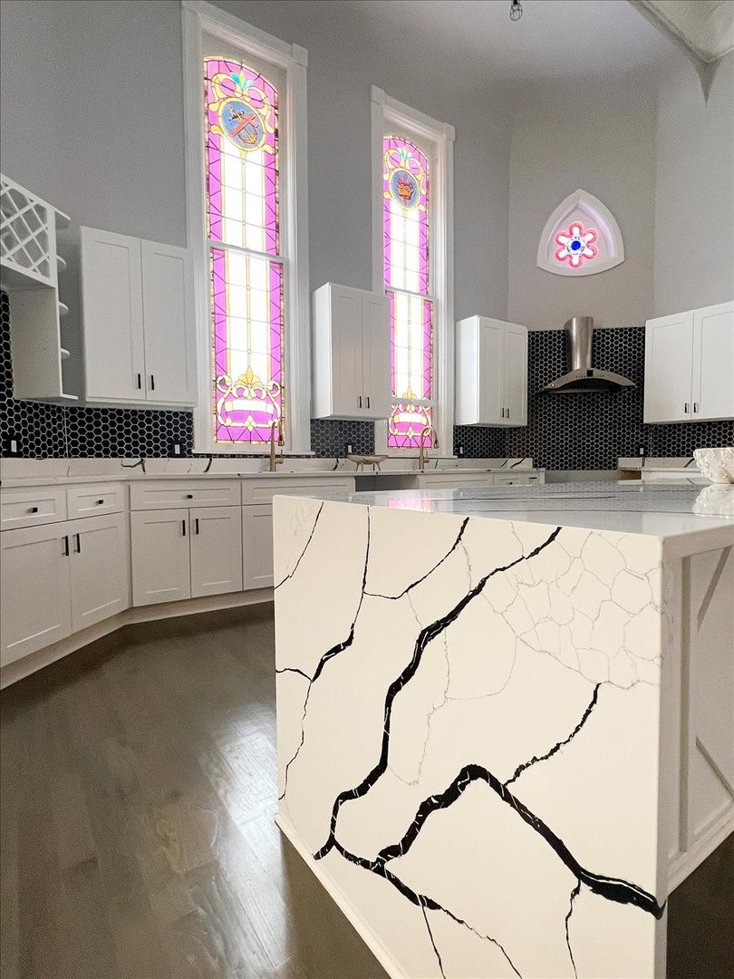 200 West Crawford Street Peotone, IL 60468 - Photo 11 of 42 a kitchen with granite countertop a sink a counter top space cabinets and a window