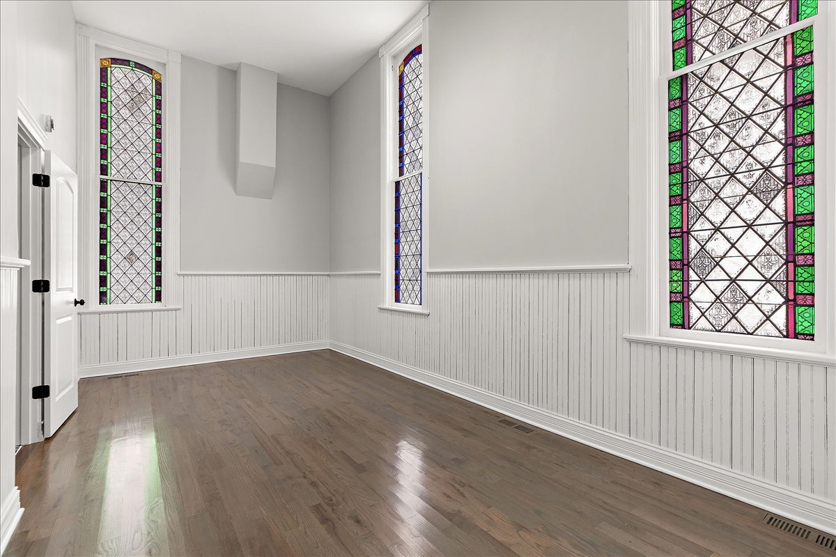 200 West Crawford Street Peotone, IL 60468 - Photo 22 of 42 an empty room with wooden floor and windows