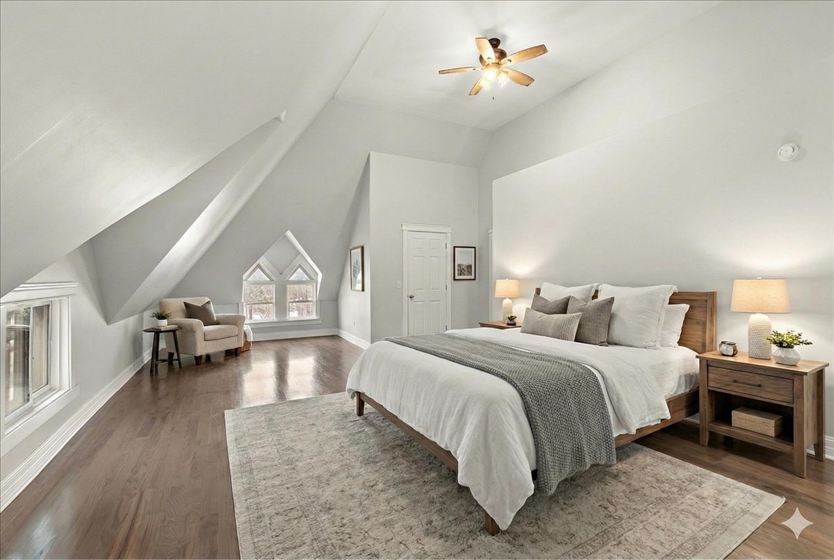 200 West Crawford Street Peotone, IL 60468 - Photo 24 of 42 a spacious bedroom with a bed couch and a ceiling fan