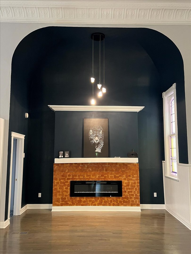 200 West Crawford Street Peotone, IL 60468 - Photo 7 of 42 a room with fireplace and wooden floor