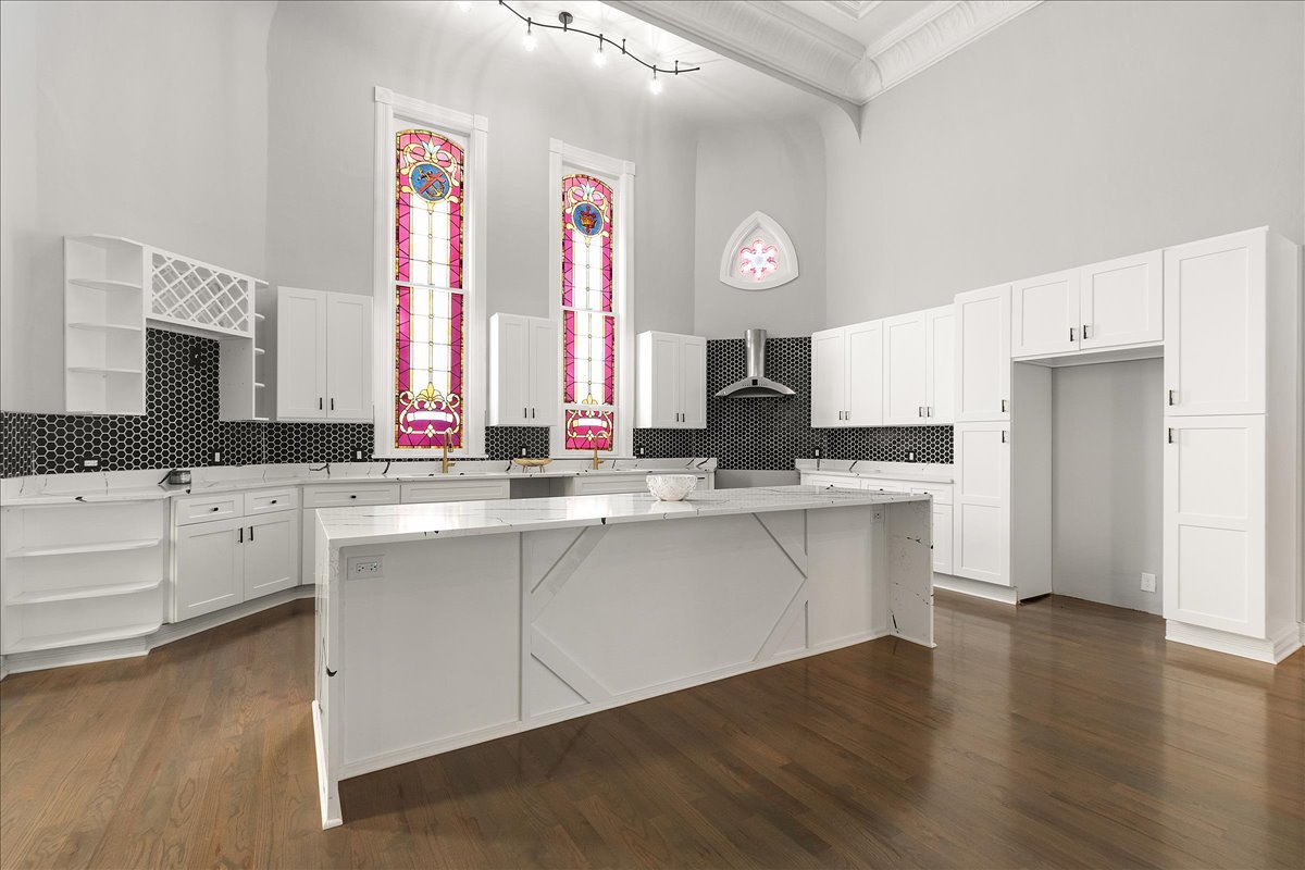 200 West Crawford Street Peotone, IL 60468 - Photo 9 of 42 a kitchen with granite countertop a sink cabinets and wooden floor