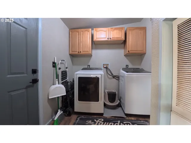 a bathroom with a sink a toilet and a window