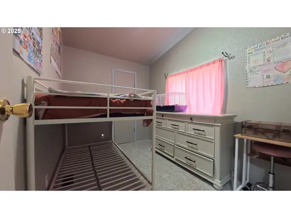 a kitchen with a refrigerator and a stove