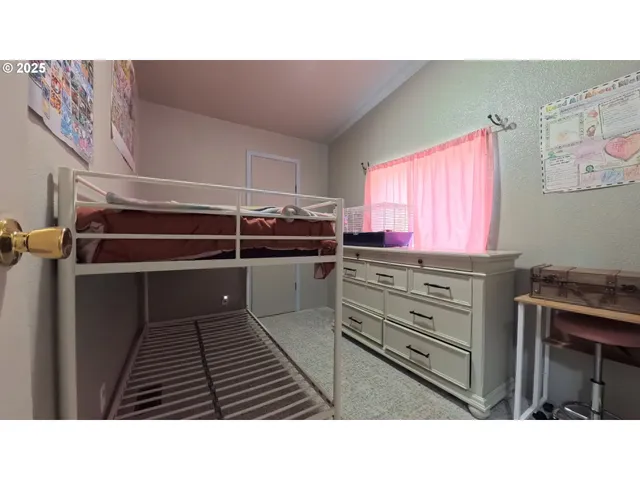 a kitchen with a refrigerator and a stove