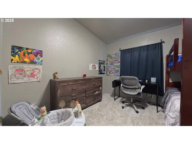 a living room with furniture and a chair