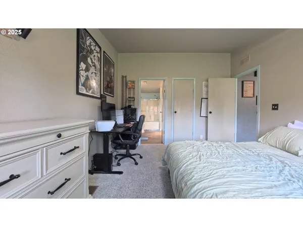 a living room with furniture and a dresser
