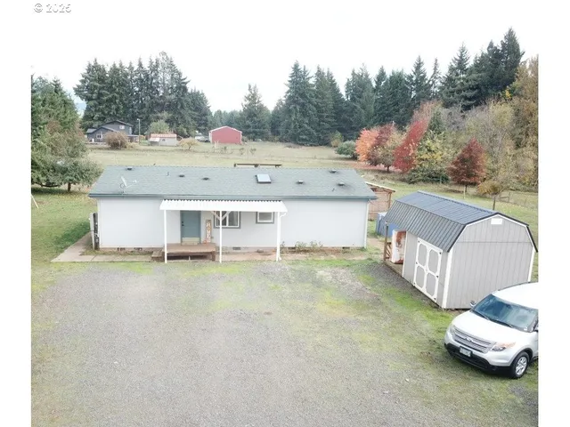 a view of a house with pool table and chairs