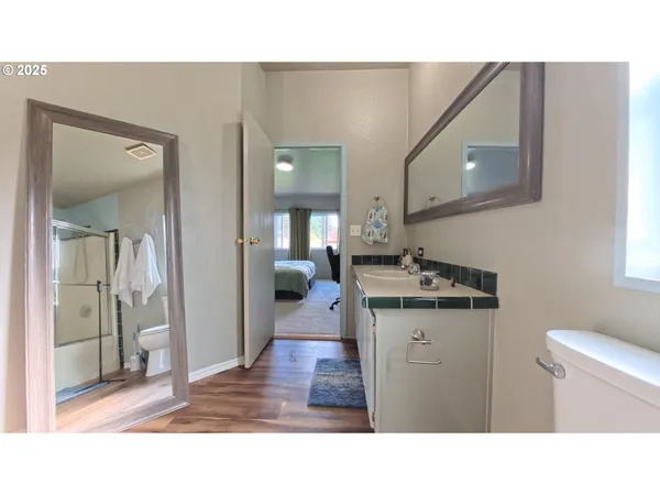 a bathroom with a sink a mirror and a toilet