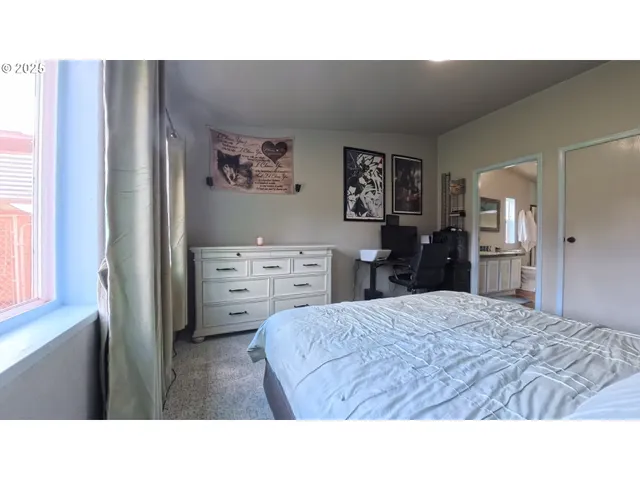 a room with a bed and a cabinets