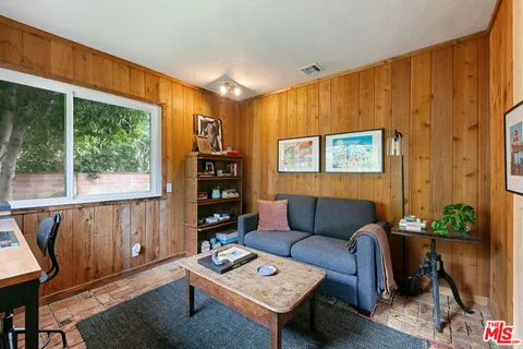 a view of living room with furniture and window