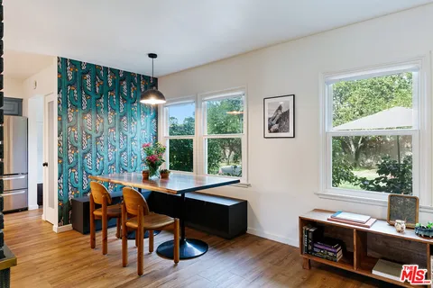 a kitchen with stainless steel appliances a sink stove and refrigerator
