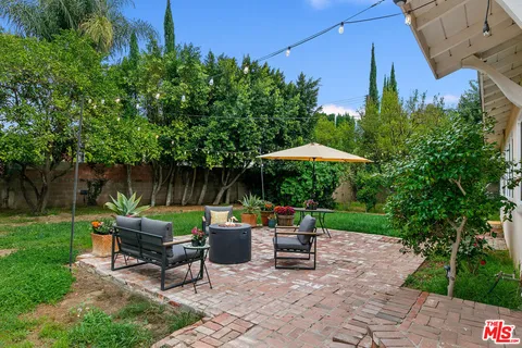 a backyard of a house with lots of green space