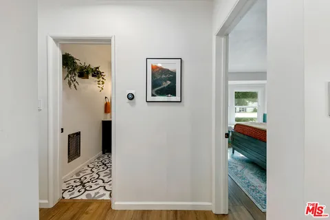 a bathroom with a toilet a sink and a mirror