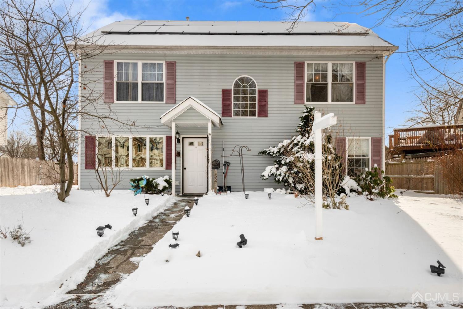 52 Caldwell Road Edison, NJ 08817 - Photo 1 of 17 a view of the house with a yard