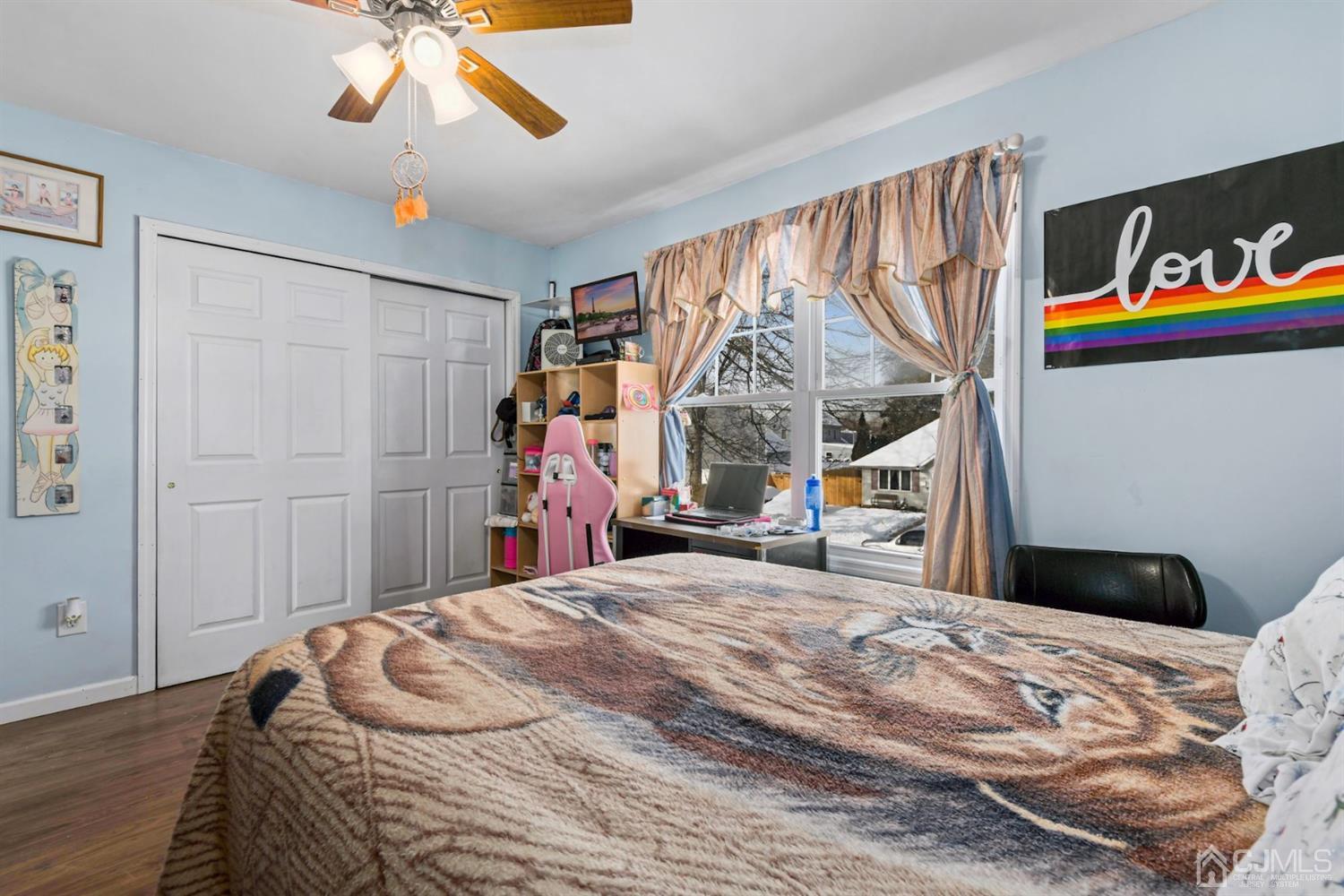 52 Caldwell Road Edison, NJ 08817 - Photo 12 of 17 a bedroom with a bed and a chandelier