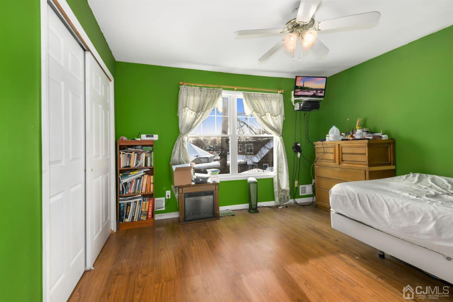 52 Caldwell Road Edison, NJ 08817 - Photo 13 of 17 a bedroom with a bed and a chandelier
