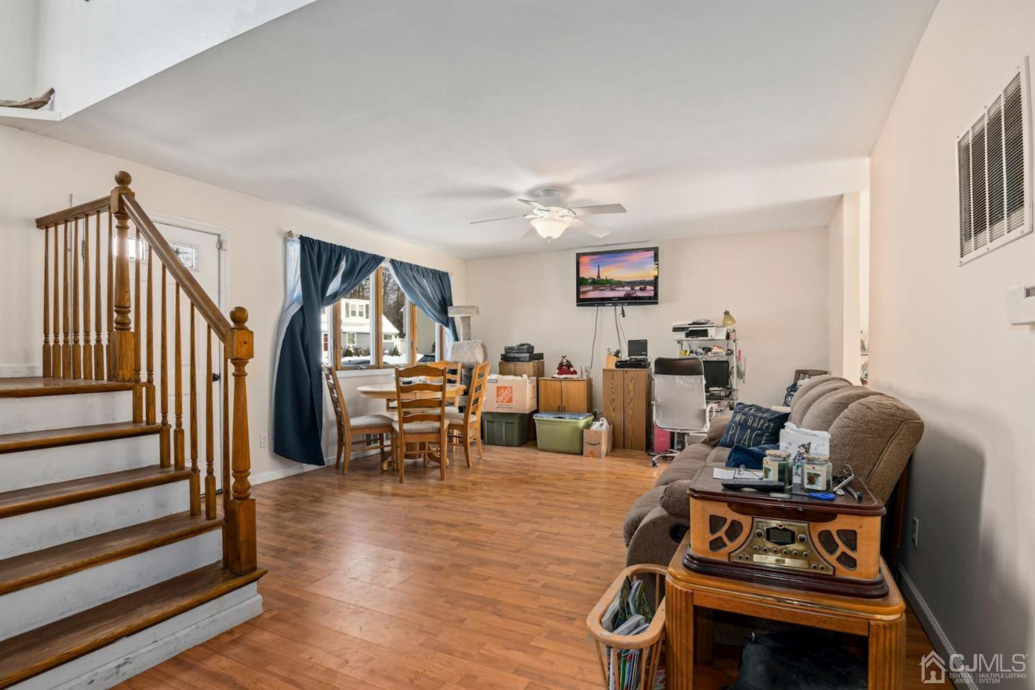 52 Caldwell Road Edison, NJ 08817 - Photo 3 of 17 a living room with lots of furniture and a wooden floor
