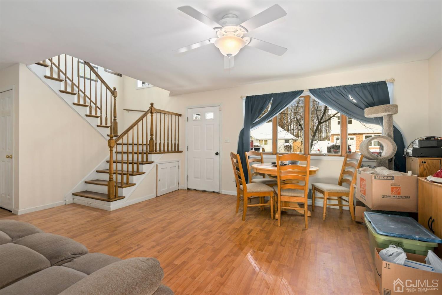 52 Caldwell Road Edison, NJ 08817 - Photo 4 of 17 a view of a livingroom with furniture and hardwood floor