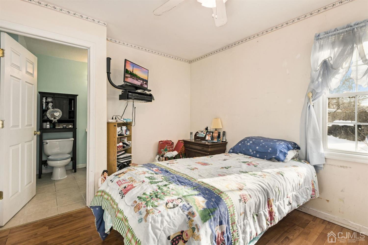 52 Caldwell Road Edison, NJ 08817 - Photo 8 of 17 a bedroom with bed and walk in closet
