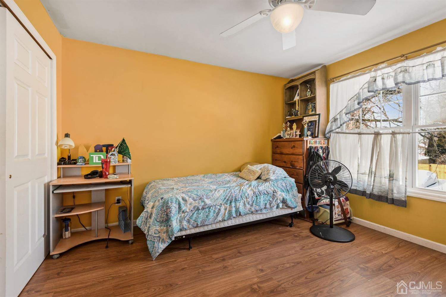 52 Caldwell Road Edison, NJ 08817 - Photo 10 of 17 a bedroom with a bed and a chandelier