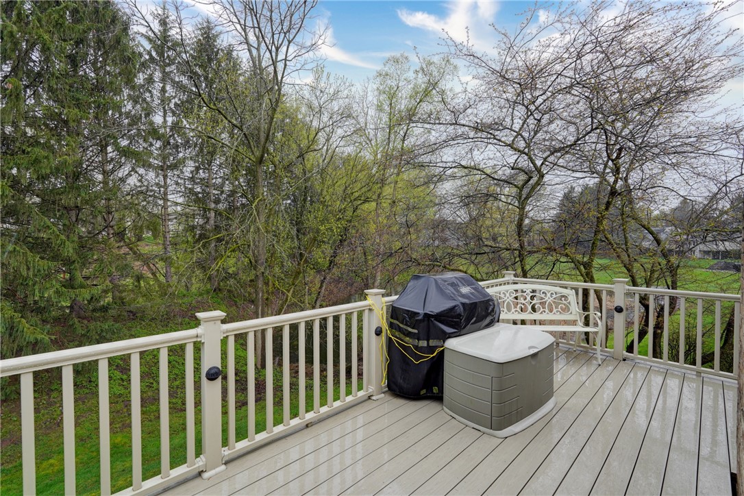 89 Creek Ridge Pittsford, NY 14534 - Photo 22 of 24 Deck Overlooks Woods And Pond