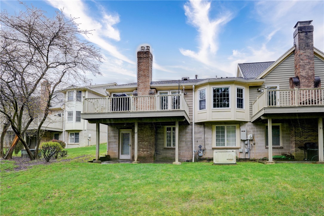 89 Creek Ridge Pittsford, NY 14534 - Photo 23 of 24 Exterior Back With Patio And Deck