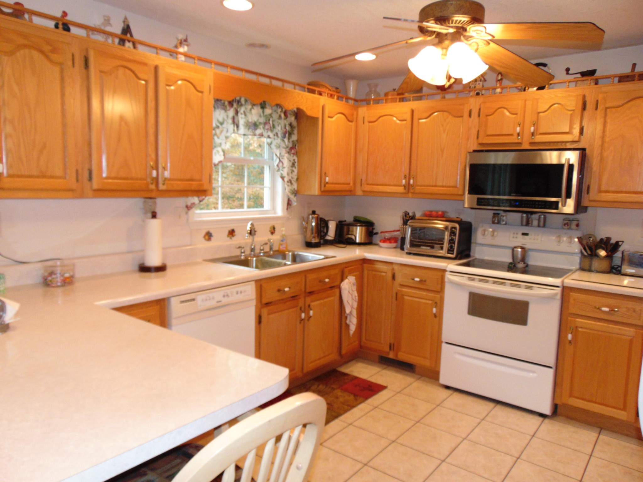 4019 Decatur Highway Kingston, TN 37763 - Photo 11 of 13 a kitchen with a sink a microwave and cabinets